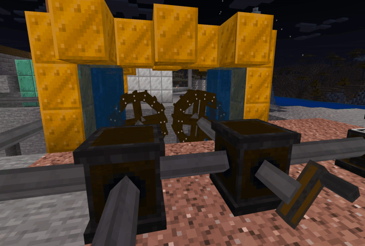 Water wheels turning a series of shafts, gearboxes, and a hand crank